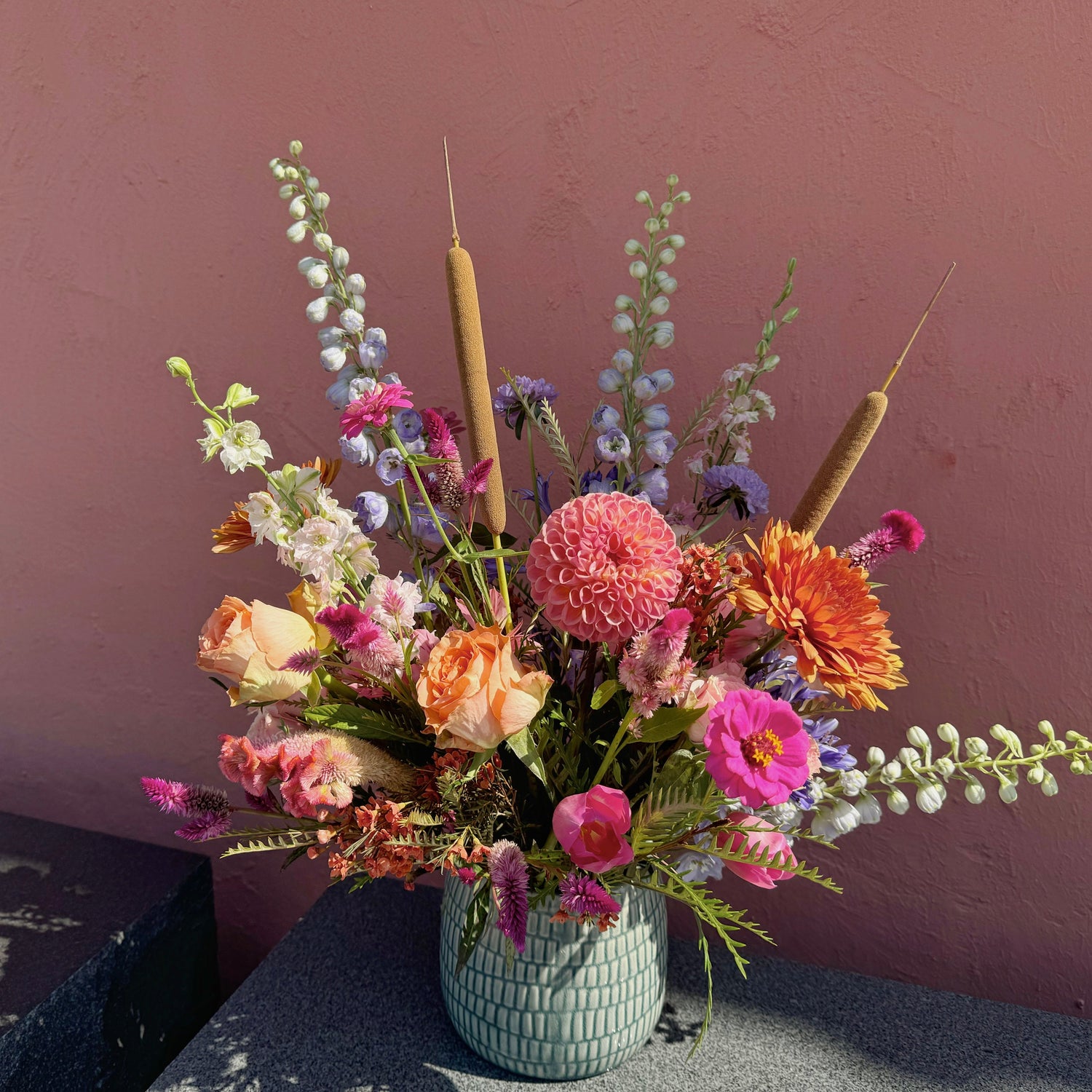 seasonal arrangement with cat tail in custom vase handcrafted
