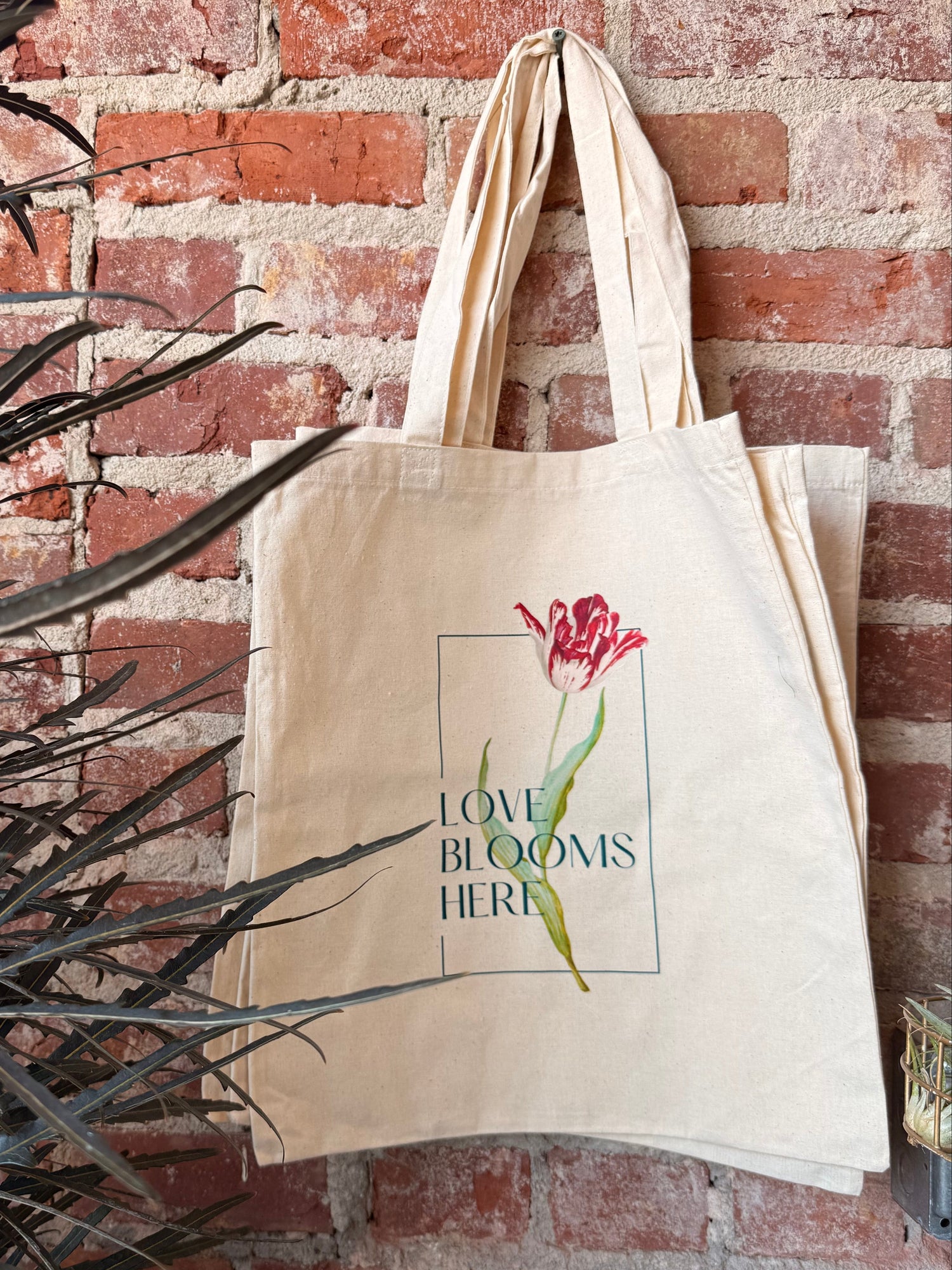canvas bag with flower and love blooms here