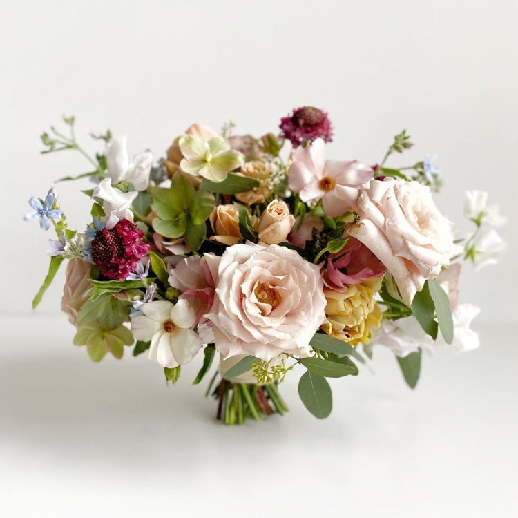 Petite bridal bouquet with multiple types of fresh cut flowers. Created by expert florist at Everbloom Design in Memphis, TN.