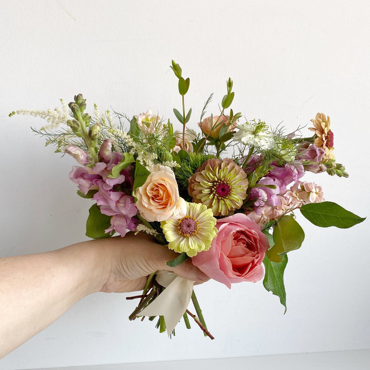 A small hand-tied bouquet for your maid in our signature wild garden style. Floral arrangement completed by Everbloom Design a Memphis, Tennessee based floral studio.