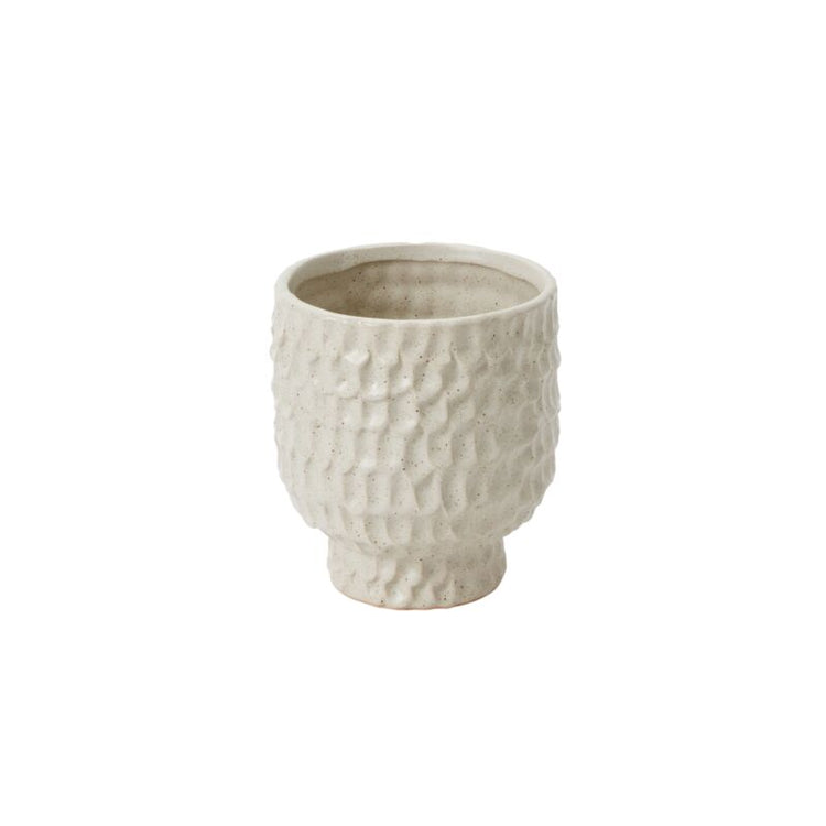 small Textured ceramic pot on a white background