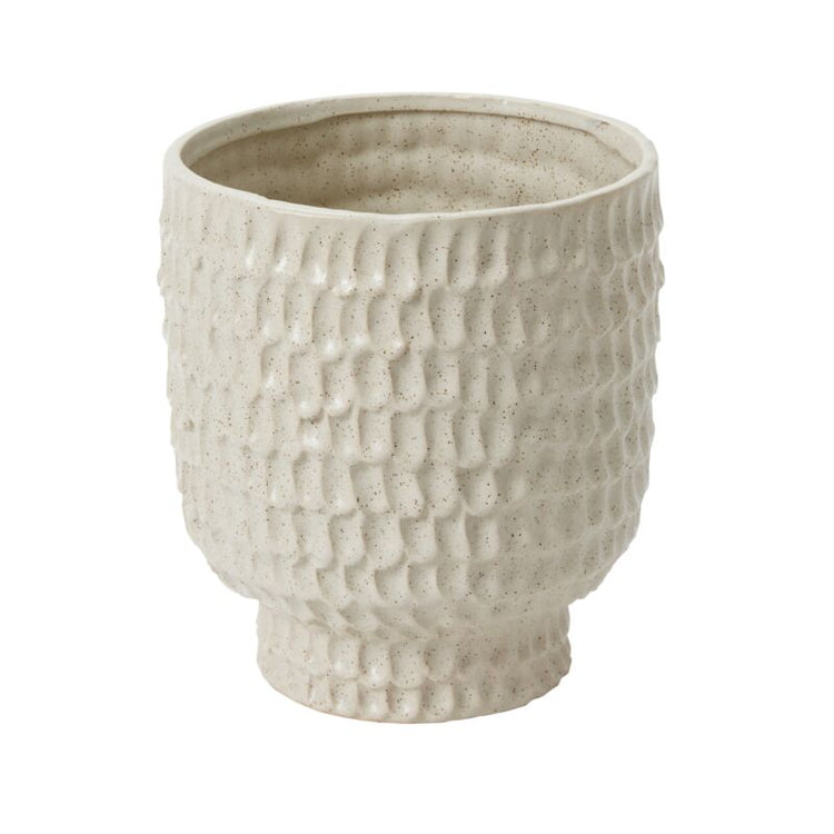 Textured ceramic pot on a white background