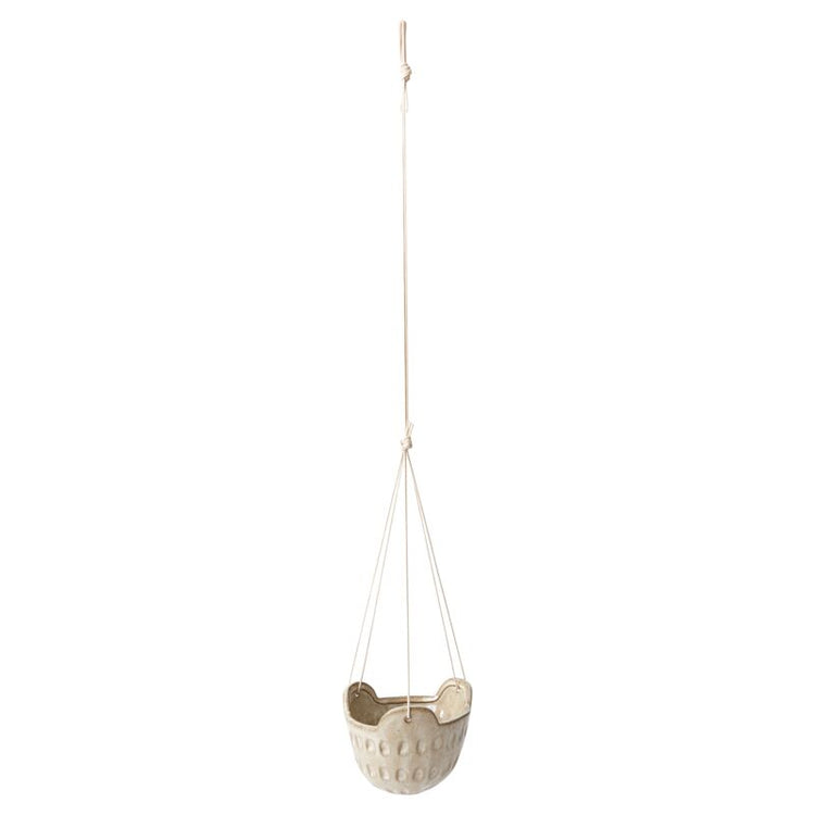 Hanging planter with a spot design on a white background