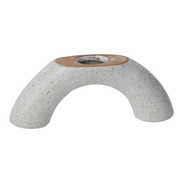 Ceramic candle holder or vase with speckled design on a white background