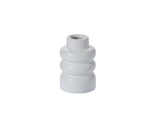 White ribbed vase on a white background
