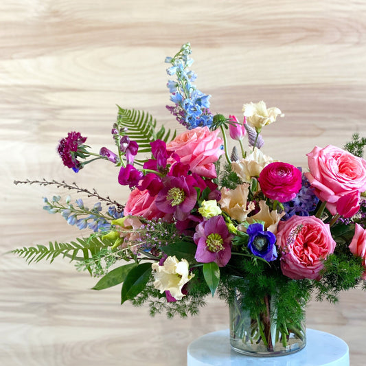 Find your perfect seasonal floral arrangement in Memphis at Everbloom Design. Our expert florists crafted this stunning arrangement in a cylindrical glass vase for the perfect finishing touch.