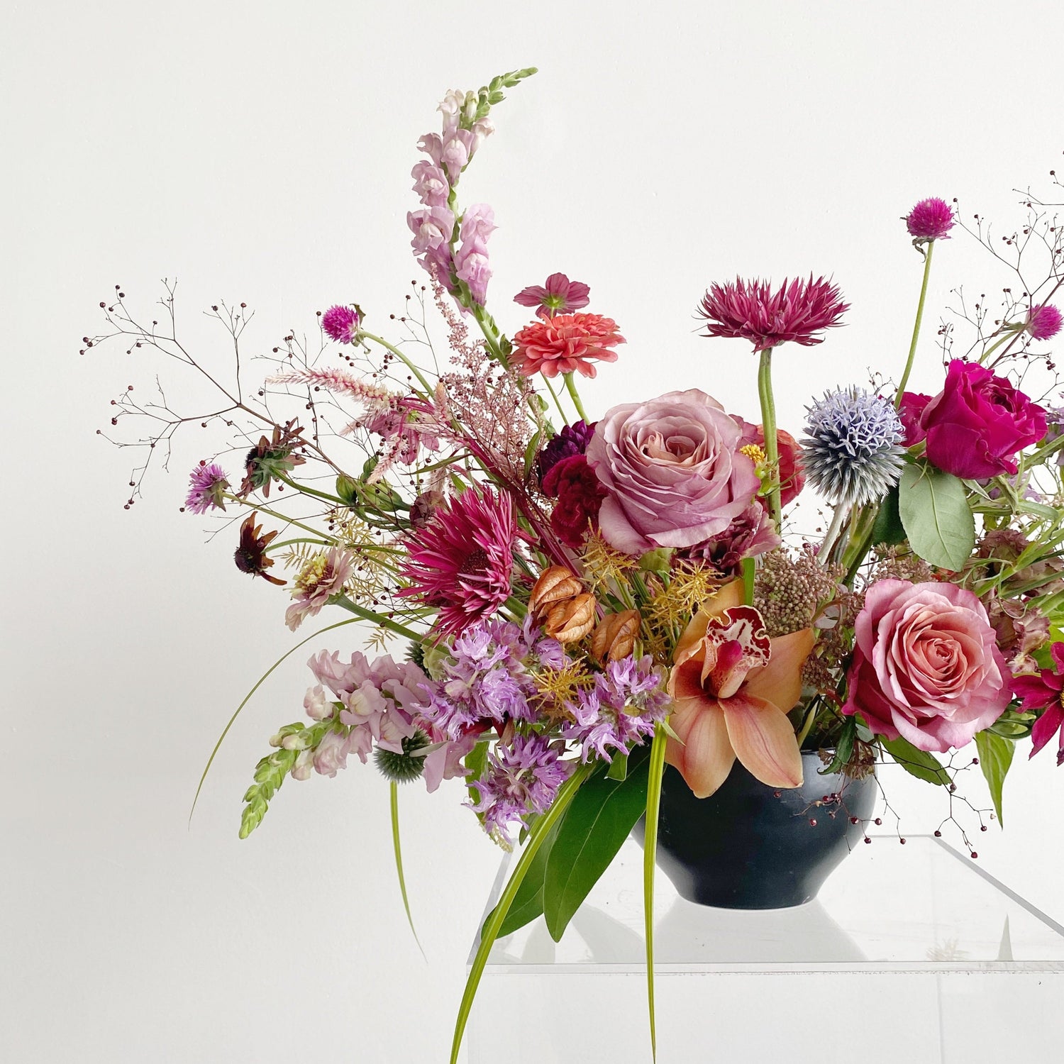 Bring a touch of Memphis style to your home or office with this beautiful seasonal floral arrangement from Everbloom Design. Our talented florists create stunning works of art like this every day.